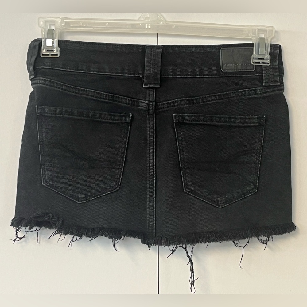 American Eagle black factory distressed jean skirt. Size 00 - Picture 4 of 10